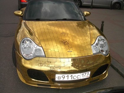 Gold. A gold covered Porsche!