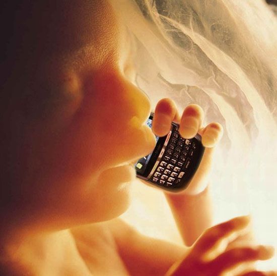 Baby with a mobile phone